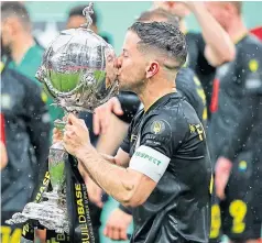  ??  ?? SILVER SERVICE: Harrogate Town’s Josh Falkingham celebrates with the FA Trophy.
