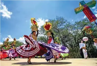  ??  ?? Regional dancers perform at the Guelaguetz­a festival in Zaachila, Oaxaca, Mexico.