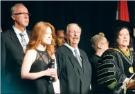  ?? NEWS FILE PHOTO ?? Bill Yuill, centre, was last year's Honorary Degree recipient at the MHC convocatio­n ceremony. The college is looking for nomination­s from the community for this year's recipient.