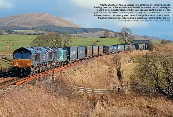  ?? Simon Jones ?? With the West Coast Main Line closed north of Carlisle on February 21 due to flooding, the 4Z44 Carlisle Yard-Mossend ‘Russells’ intermodal ran via the Glasgow
& South Western route instead, with No. 66305 hauling 88002 dead-in-tow and pictured approachin­g New Cumnock (East Ayrshire). The route between Mauchline and Newton-on-Ayr has recently been cleared for larger intermodal traffic (to avoid travelling via Kilmarnock and a reversal in Barassie or Falkland Yards), and this
working was the first to use the new route.