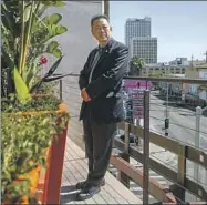  ?? Jason Armond Los Angeles Times ?? T.C. KIM, a community leader and former journalist, shot photos of armed Korean Americans on roofs in 1992.