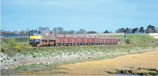  ?? JAY MONAGHAN ?? With freight on the agenda of the Strategic Rail Review, 071 Class No. 077 heads the 09.15 Navan/ Alexandra Road (Boliden Terminal) to Dublin Port Tara Mines train on the approach to the Malahide estuary on March 2. The loco had only recently returned to traffic after more than a year at Inchicore works for overhaul.