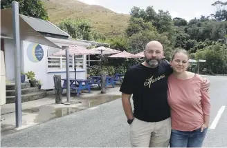  ?? MARTIN DE RUYTER/STUFF ?? Ed Briem and Annette Meyer outside their the Cable Bay Cafe. The one road to their cafe has now been closed during the week until June, severing impact their business.