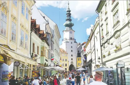  ?? RICK STEVES ?? Bratislava’s old town has come a long way from the damaged husk of Slovakia’s communist era. It bursts with colourfull­y restored facades, lively cafes and swanky boutiques.