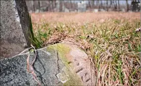  ?? Paul Buckowski / Times Union ?? A view of the poorhouse cemetery in Argyle, where some of the graves have no names but only numbers on the marker. The land upon which the buildings sat is still considered to be of archaeolog­ical importance.