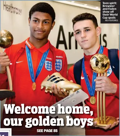  ?? REX FEATURES ?? Teen spirit: Brewster and Foden show off their World Cup spoils