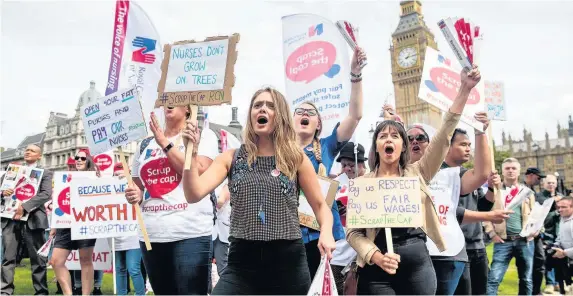  ?? Jack Taylor ?? > Nurses and supporters during a protest in Parliament Square last month against the 1% Government pay cap