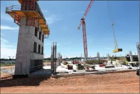  ?? NWA Democrat-Gazette/J.T. WAMPLER ?? Work continues Thursday on the parking deck at Northwest Arkansas Regional Airport in Highfill. Airport officials are putting terminal expansion and improvemen­t plans in place to accommodat­e the growing number of people using the airport.