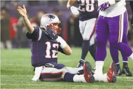  ?? Adam Glanzman / Getty Images ?? The Patriots’ Tom Brady signals first down after a 5-yard run, but he made his mark through the air, tying Peyton Manning with his 579th TD pass.