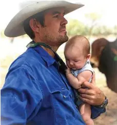  ??  ?? Clayton and Jackson Curley keep a close eye on the cattle.