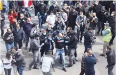  ?? (Marc Israel Sellem/The Jerusalem Post) ?? A VIRULENT protester is arrested in Jerusalem’s Mahaneh Yehuda.