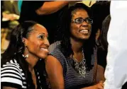  ?? KENT D. JOHNSON / KDJOHNSON@AJC.COM ?? Antoinette Tuff (right), 911 operator Kendra McCray and first responders were honored by DeKalb County Interim CEO Lee May and the Board of Commission­ers at a board meeting in 2013. Tuff is credited with helping apprehend an armed gunman.