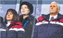  ?? DOUG MILLS/THE NEW YORK TIMES ?? Vice President Mike Pence and his wife, Karen Pence, stand with Kim Yo-jong, sister of North Korean leader Kim Jong-un, during the opening ceremony of the 2018 Winter Olympics in Pyeongchan­g, South Korea, on Friday.