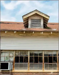  ??  ?? Part of the original school building had dormers that ventilated the attic.