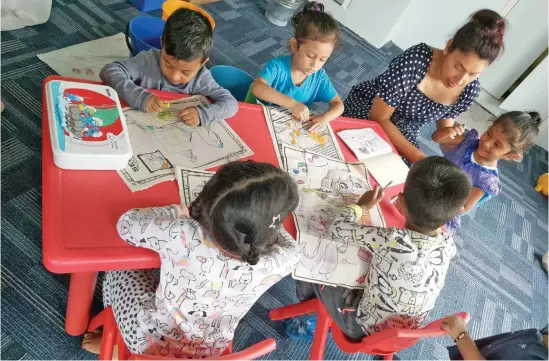  ?? Photo: Priti Lata ?? Children of Priti’s Preschool and Daycare Center in Nakasi learning and drawing.