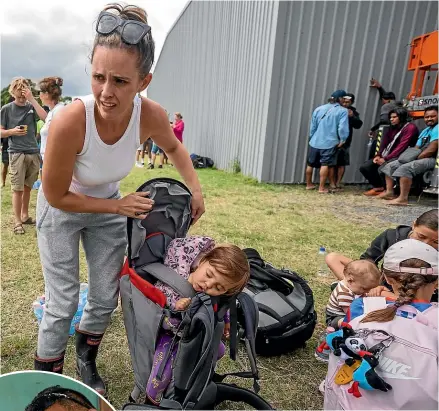  ?? JUAN ZARAMA PERINI ?? Sheena McCann with her baby Charli, 17 months, dozing in a backpack were among 200 people evacuated from Eskdale. Left, Steve and Karen Tipu escaped with their family before their Pakowhai house was destroyed. Below, Bill Eshleman with all he has left from his destroyed home. Below right, An aerial view of a house affected by the floods in Eskdale.