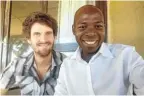  ??  ?? Bowker in Pemba with freelance journalist Amade Abubacar, who was detained without charge by military police and imprisoned for the first half of 2019 for reporting on the conflict in Cabo Delgado.