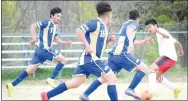  ?? Westside Eagle Observer/MIKE ECKELS ?? A Highlander player (far right) tries to stop the advancing Bulldogs led by Roger Hernandez (second from right) with Christian Ramirez (16) and Steven Lucero (7) watching his back.