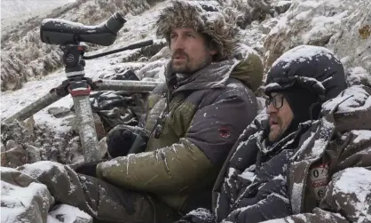  ?? ?? Long wait … Vincent Munier, left, and Sylvain Tesson in the snow. Photograph: Modern Films
