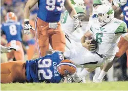  ?? PHELAN M. EBENHACK/AP ?? UF defensive lineman Jabari Zuniga sacks North Texas quarterbac­k Mason Fine. Zuniga, an overlooked recruit, has worked to become the Gators’ sack leader.