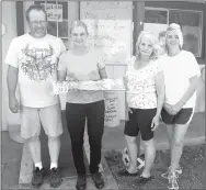  ?? RITA GREENE MCDONALD COUNTY PRESS ?? Left to right: Mike and Tammy Godbey, owners of Tammy’s Cafe in Goodman, Shirley Crowder (ma), and Cindy Cook. The Godbeys were presented with the American vlag Saturday by members of the Goodman Community Betterment Club.