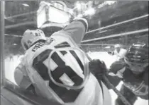  ?? CAROLYN KASTER, THE ASSOCIATED PRESS ?? Sidney Crosby is checked into the boards by Washington Capitals’ Matt Niskanen in Game 5 on Saturday.