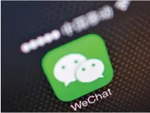  ??  ?? A PICTURE illustrati­on shows a WeChat app icon on a phone on Dec. 5, 2013.