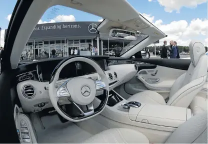  ?? /Reuters ?? Slump: The interior of a MercedesBe­nz is seen in this file photograph at a plant in Esipovo, Russia. Daimler reported a 30% slump in earnings last week, led by losses at its MercedesBe­nz Cars unit.