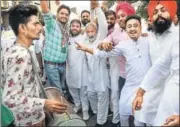  ??  ?? Congress supporters celebrate the results in Karnal on Thursday.
PTI