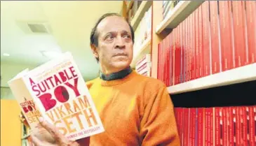  ?? HT PHOTO: SANJEEV VERMA ?? Vikram Seth in Delhi in 2013, holding a 20th anniversar­y edition of his novel,Seth has an ideal reader, someone who “should know the life and times of the world of which I’m writing”.