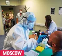  ??  ?? MOSCOW
Medic carries out test at Vnukovo Airport