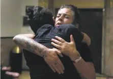  ?? Paul Chinn / The Chronicle ?? Micah Allison hugs a supporter before a hearing for her husband, Derick Almena, who was denied release Friday.