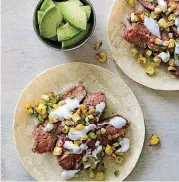  ?? TEST KITCHEN VIA AP] [JOE KELLER/AMERICA’S ?? Flank steak tacos with charred corn salsa