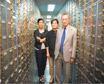  ?? Sean Lyness ?? The documentar­y “Abacus: Small Enough to Jail” shows how a small bank was targeted by government prosecutor­s. Shown: Vera Sung (left), Jill Sung and Thomas Sung.