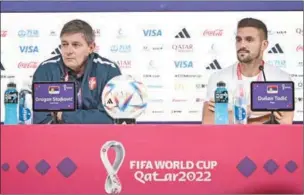  ?? (AFP) ?? Serbia’s coach Dragan Stojkovic (L) and Serbia’s forward Dusan Tadic address a press conference at the Qatar National Convention Center (QNCC) in Doha on Wednesday on the eve of their FIFA World Cup Qatar 2022 match against Brazil.