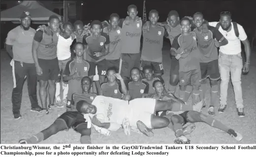  ??  ?? Christianb­urg/Wismar, the 2 nd place finisher in the GuyOil/Tradewind Tankers U18 Secondary School Football Championsh­ip, pose for a photo opportunit­y after defeating Lodge Secondary