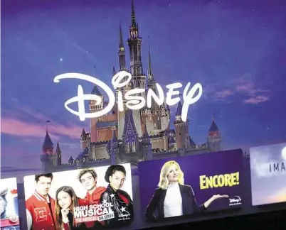  ?? Steven Senne / Associated Press ?? A Disney logo forms part of a menu for the Disney Plus movie and entertainm­ent streaming service. Disney Plus says it hit more than 10 million sign-ups on its first day of launch.