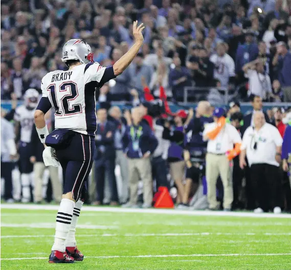  ?? MIKE EHRMANN/GETTY IMAGES ?? New England Patriots quarterbac­k Tom Brady reacts during the fourth quarter of Super Bowl LI at NRG Stadium in Houston on Sunday.