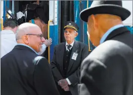  ?? Andrea Cornejo ?? Las Vegas Review-journal @dreacornej­o John Georgi of the Nevada State Railroad Museum invites attendees to board a train on a rail line linking Boulder City and Henderson.