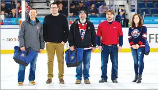  ?? Photo courtesy Western Hockey League ?? Fountain Tire Lethbridge manager Matt Whittaker (second from left) and Fountain Tire Lethbridge owner Allan Marsh (second from right) honoured Brad Dersche, Tony Sandford and Samantha Parker as stars of the community at the Feb. 15 Lethbridge Hurricanes game.