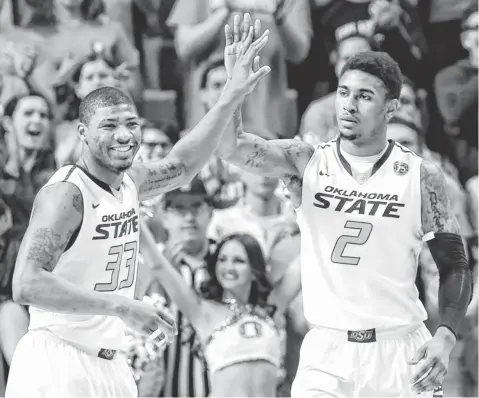  ?? ALONZO ADAMS, USA TODAY SPORTS ?? The three- game suspension “felt like years for me,” said Marcus Smart, left, celebratin­g with teammate Le’Bryan Nash.