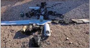  ?? (AP/Internatio­nal Coalition) ?? Parts of the wreckage of an intercepte­d drone are displayed Tuesday near the Ain al-Asad air base in western Iraq.