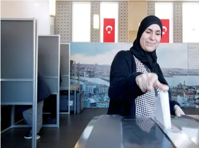  ?? — Reuters ?? A woman casts her ballot in the Turkish mosque Eyup Sultan in Amsterdam East on Wednesday.