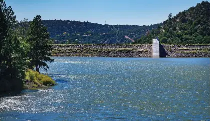  ?? JIM WEBER/NEW MEXICAN FILE PHOTO ?? Nichols Reservoir on Sept. 9. Constructi­on work on Nichols — which contains water from the Santa Fe River, one of the city’s four water sources — will be discussed in two public water resources meetings April 25. Two Mile Pond will also be discussed at the meeting.