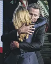  ?? Jay L. Clendenin Los Angeles Times ?? GOV.-ELECT Gavin Newsom hugs his wife, Jennifer Siebel Newsom, as he takes the stage at an election night celebratio­n in Los Angeles this month.