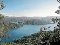  ?? STUFF ?? The heavily forested inlets and bays of Lake Waikaremoa­na.