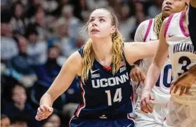  ?? Laurence Kesterson/Associated Press ?? UConn Dorka Juhasz (14) fights for position under the basket during Saturday's win at Villanova.