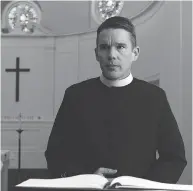  ?? A24 VIA THE ASSOCIATED PRESS ?? Ethan Hawke settles into the role of a melancholi­c priest as if he’s never played anything else, Chris Knight writes.