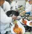  ?? WEI XIAOHAO / CHINA DAILY ?? Chefs in a Suzhou restaurant prepare the city’s famous dish, flying squirrel fish.