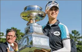  ?? DANIEL VARNADO/FOR THE AJC ?? With the KPMG Women’s PGA Championsh­ip win Sunday at Atlanta Athletic Club in Johns Creek, Nelly Korda is the first American to take the No. 1 spot in the women’s world rankings since Stacy Lewis did it in 2014.
